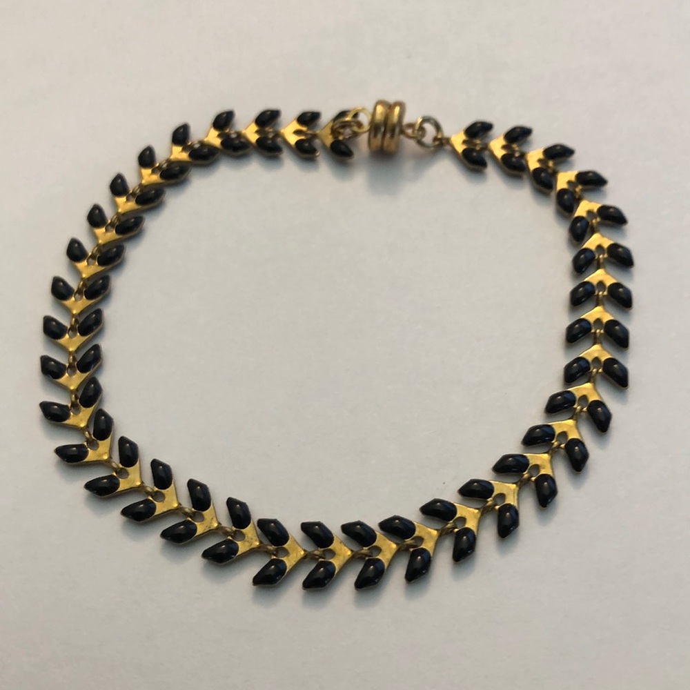 Gold tone and black enamel leaf bracelet.